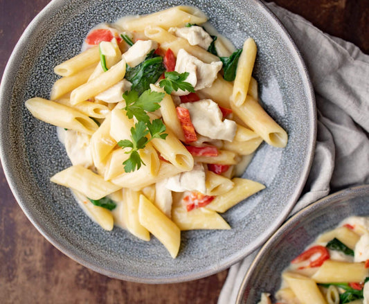 Quick one-pot pasta dinner recipe for the family with chicken and spinach in cream sauce